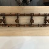 Wooden coat rack with swivel hooks