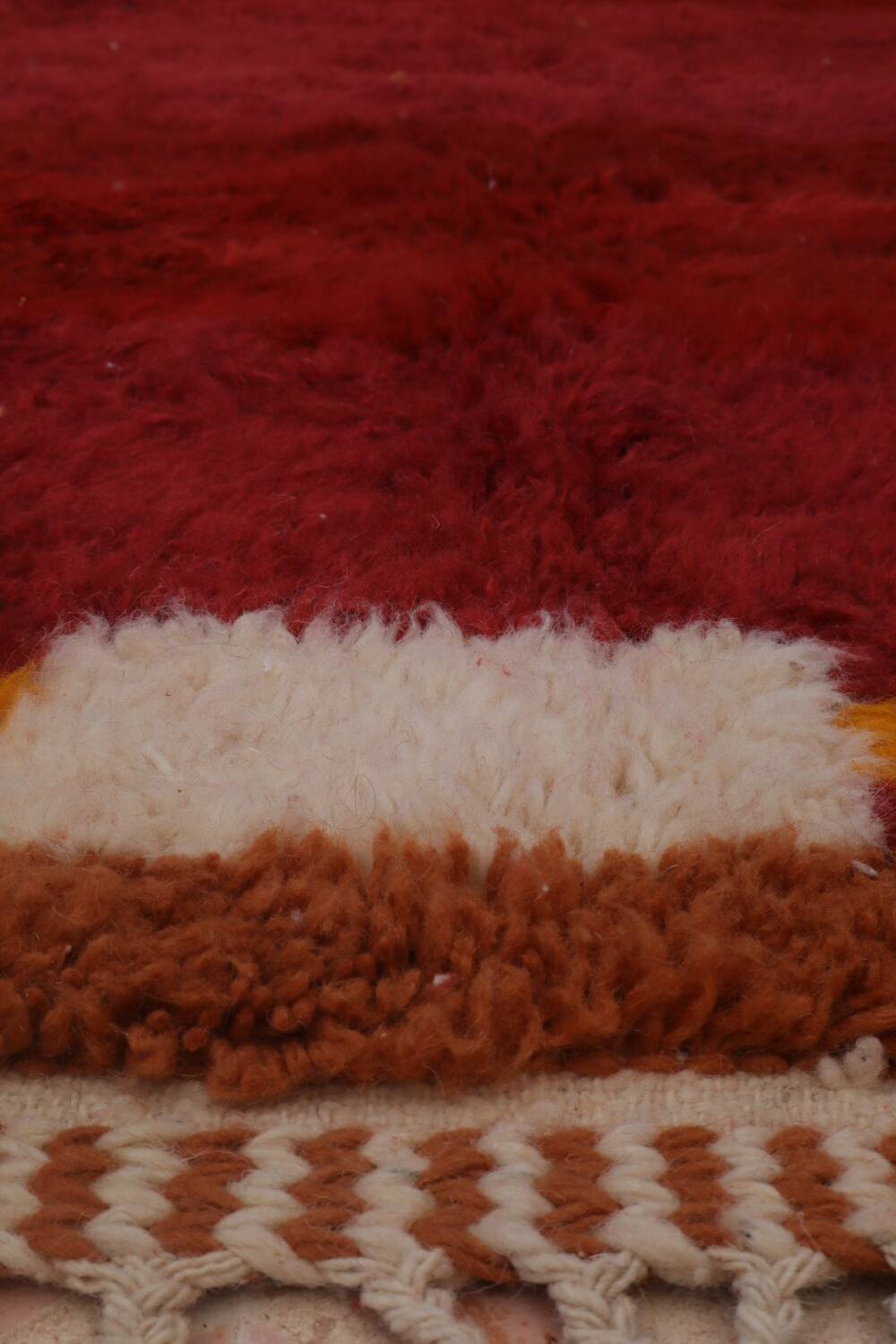Minimalist burgundy cherry red shaggy berber rug