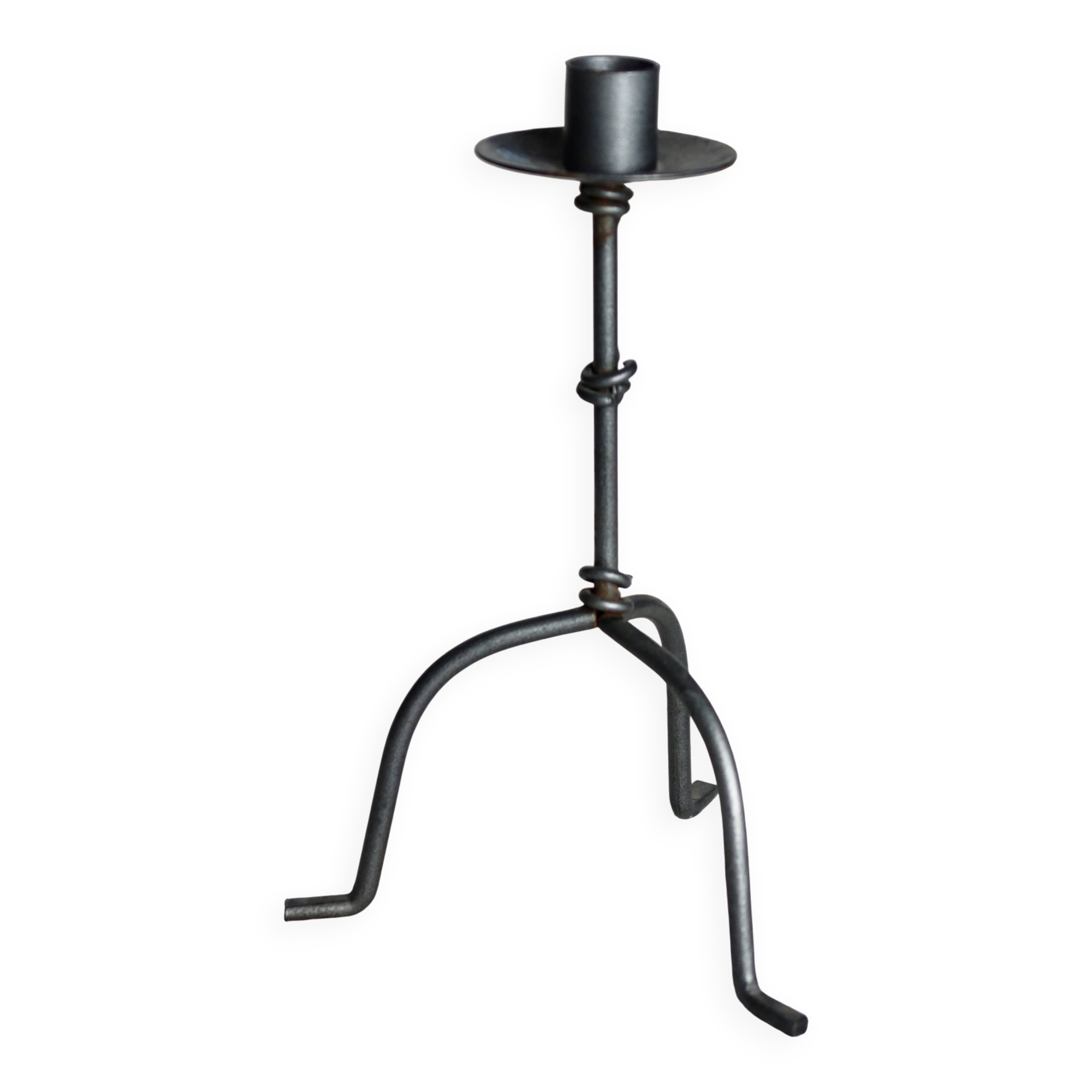 Antique tripod metal candlestick with knot decoration
