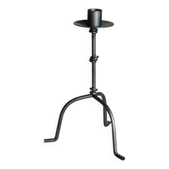 Antique tripod metal candlestick with knot decoration