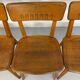 Set of 4 vintage solid oak chairs, 1960s design with sculpted backrest.