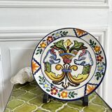 Decorative ceramic plate with griffins