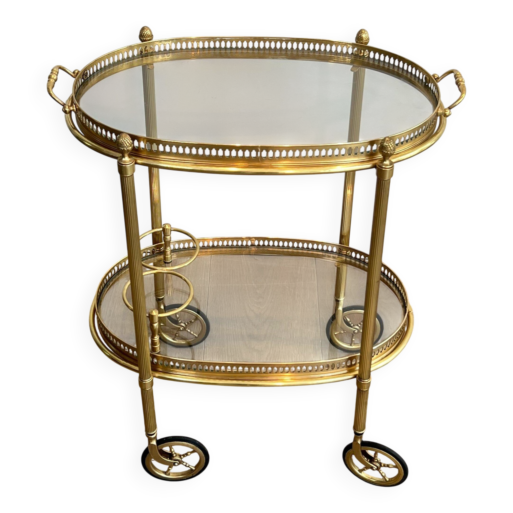 Small oval rolling table in brass with double removable trays from Maison Bagués.