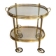 Small oval rolling table in brass with double removable trays from Maison Bagués.