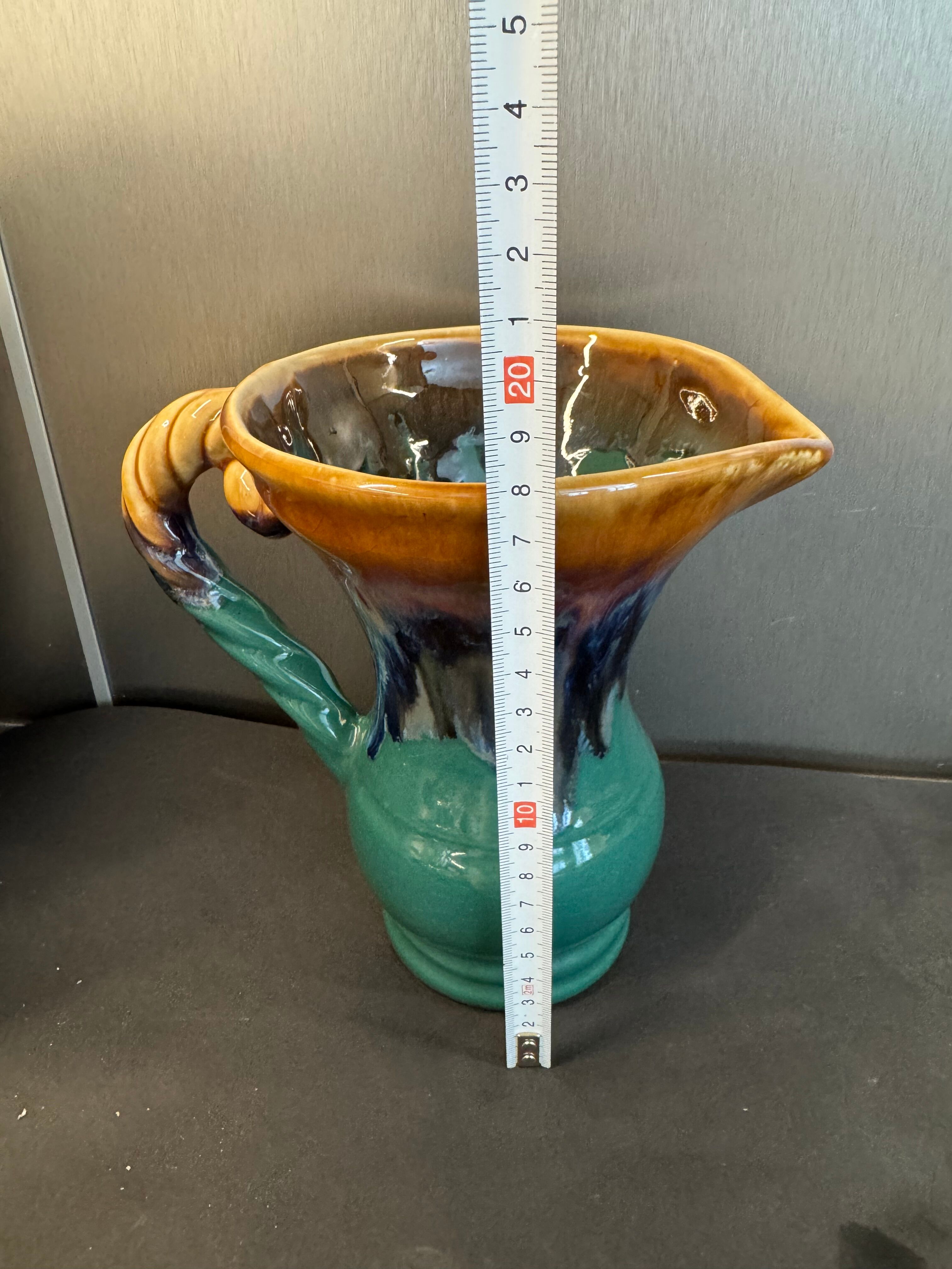 Flamed stoneware pitcher signed Alpho, no. 114