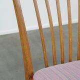 Set of 2 vintage dining chairs from the 1970s with spindle backrest and fabric seat