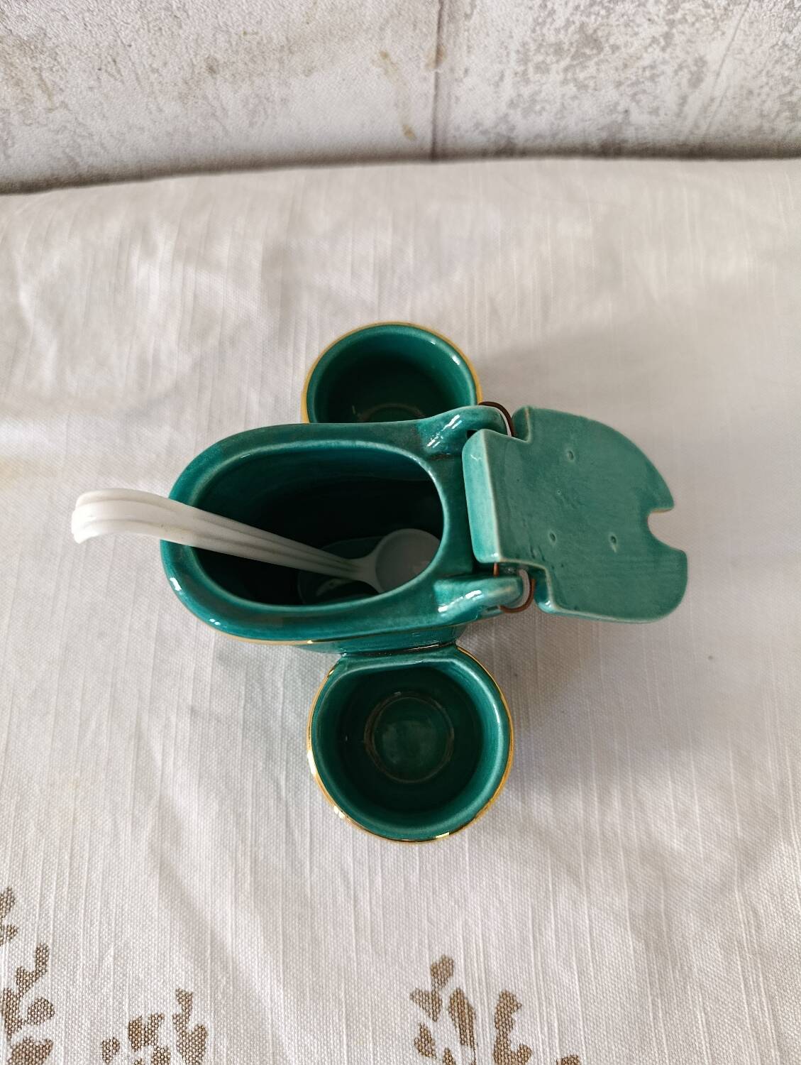 Mustard and salt pepper shaker in the shape of a toilet.