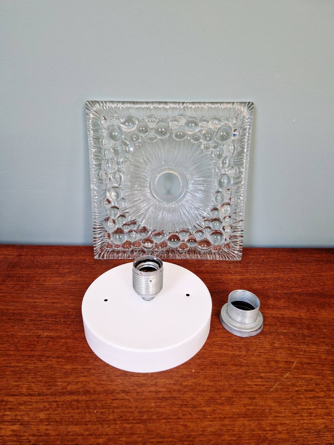 Space Age wall light in pressed transparent moulded glass, 1970.