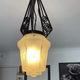 Hanging lamp in wrought iron and pressed molded glass, art nouveau
