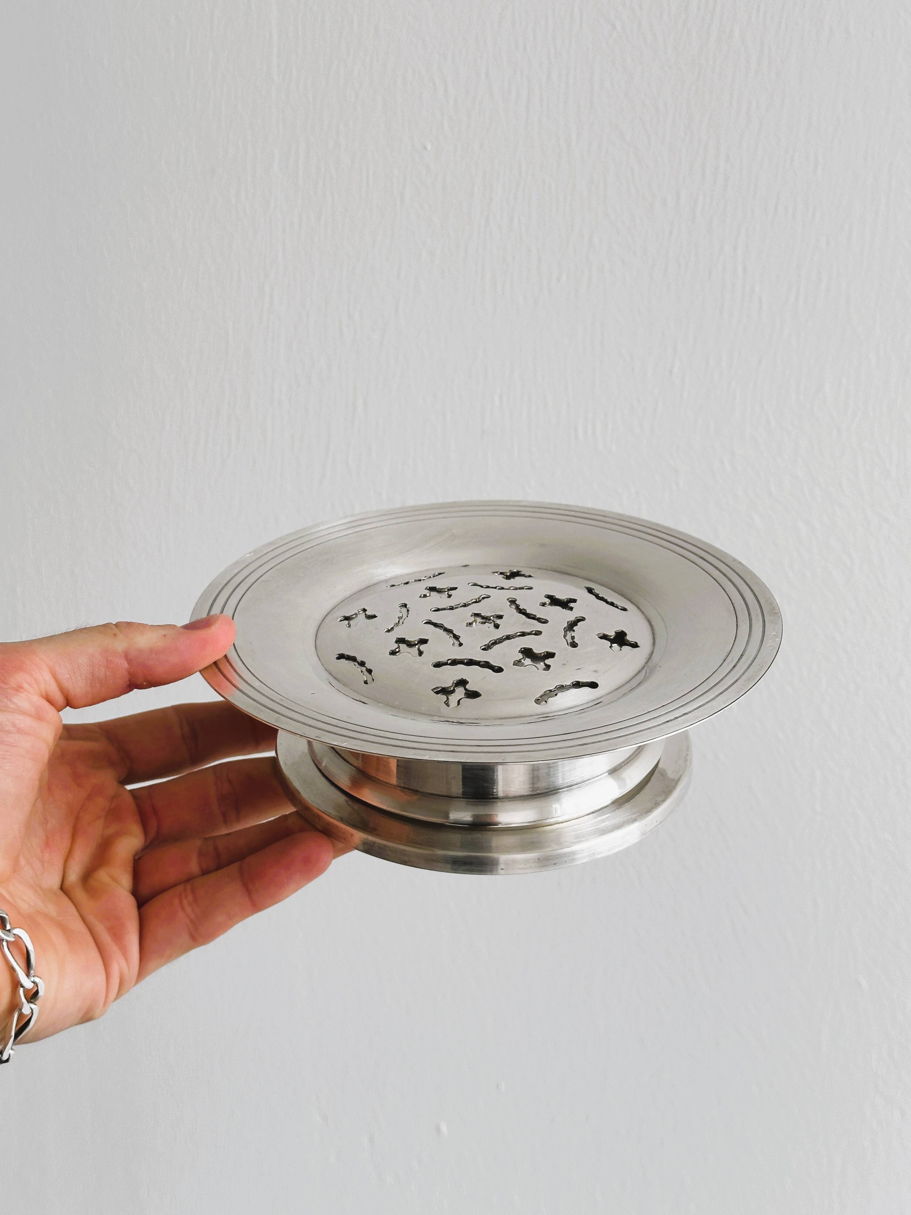 Antique butter dish in shiny metal