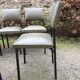 8 chaises vintage en skaï vert bouteille et piétement en tube carré métallique