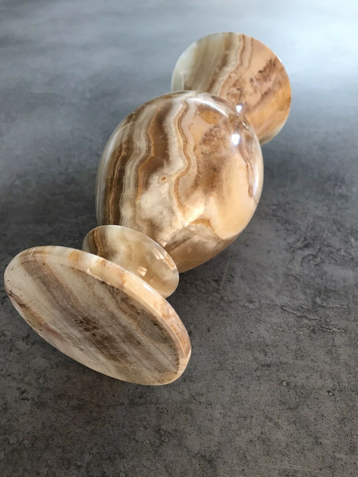 Vintage vase in marbled onyx stone shades of beige and brown