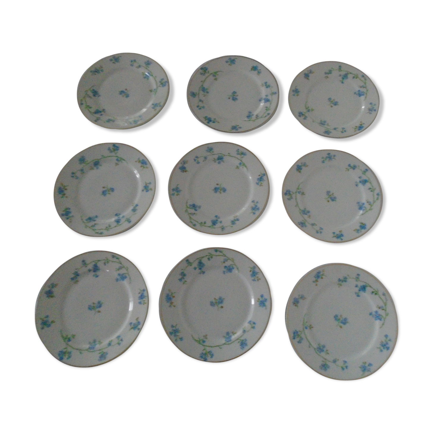 9 plates dessert porcelain of Limoges decorated with small blue flowers