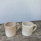 Duo of old beige Veillard Bordeaux coffee cups