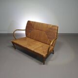 Vintage French papercord sofa with a metal frame base