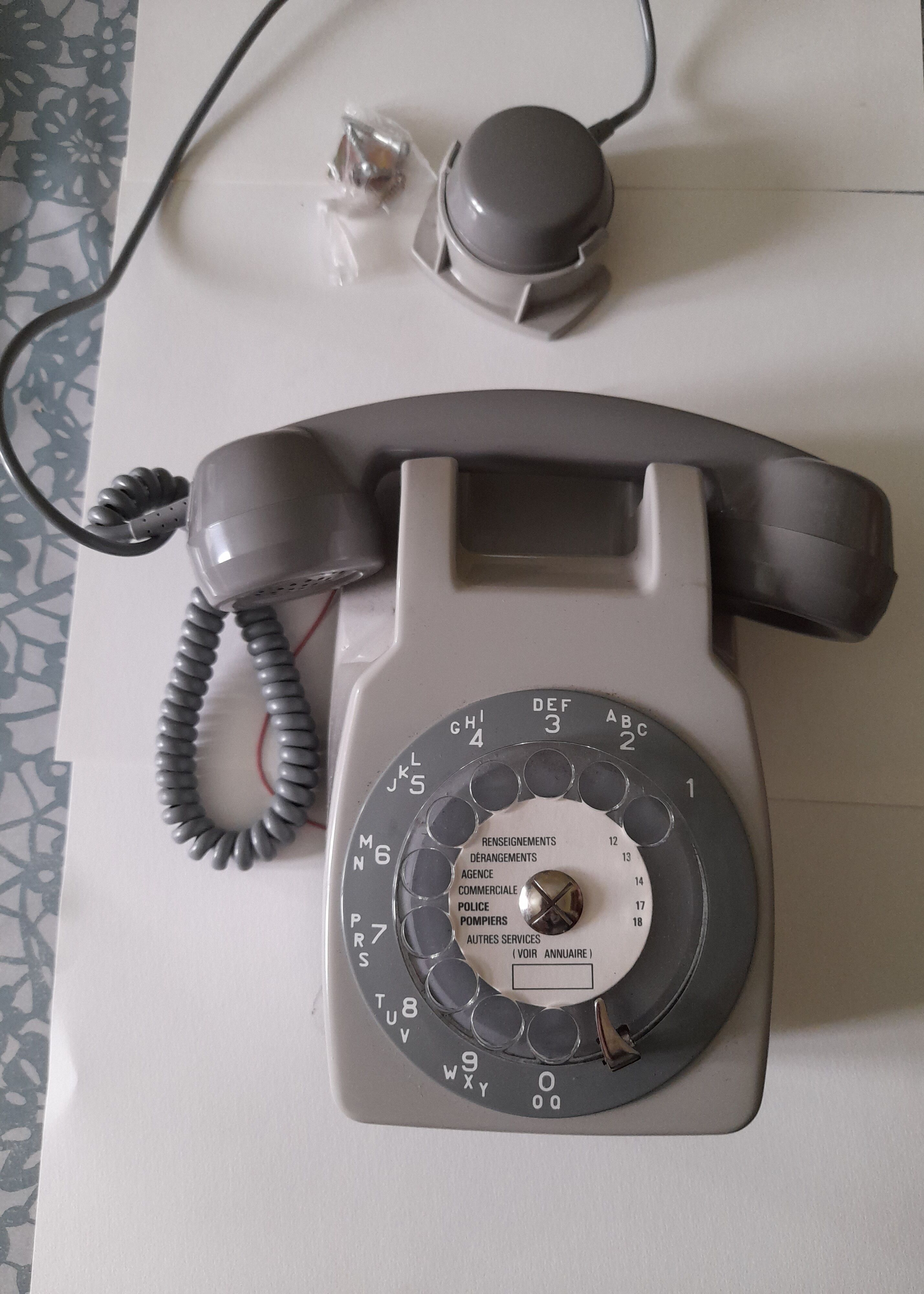 Wall telephone with dial with amplifier