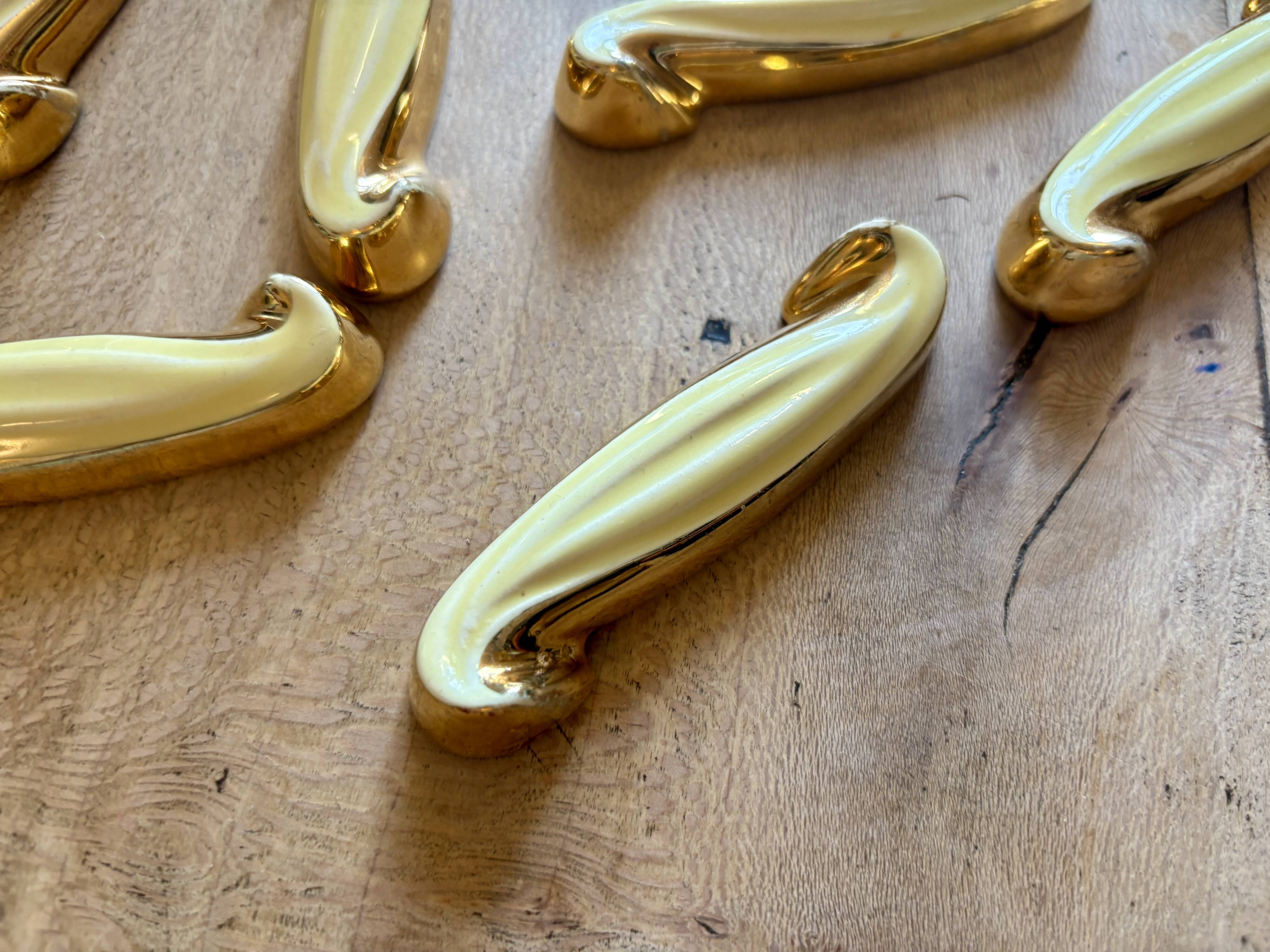 Set of 12 vintage art deco yellow and gold ceramic knife rests