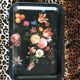 Black tray with floral motifs
