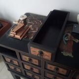 Furniture with an ancient Asian apothecary drawer