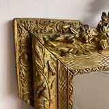 Golden trumeau mirror for fireplace, late 19th century, with sculpted pediment.
