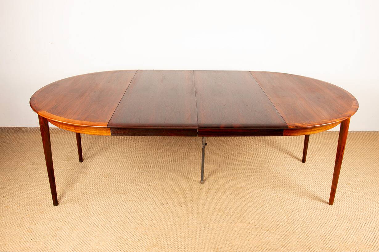Danish extendable dining table in rosewood by Kai Lyngfeldt Larsen.