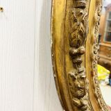 Large golden oval mirror