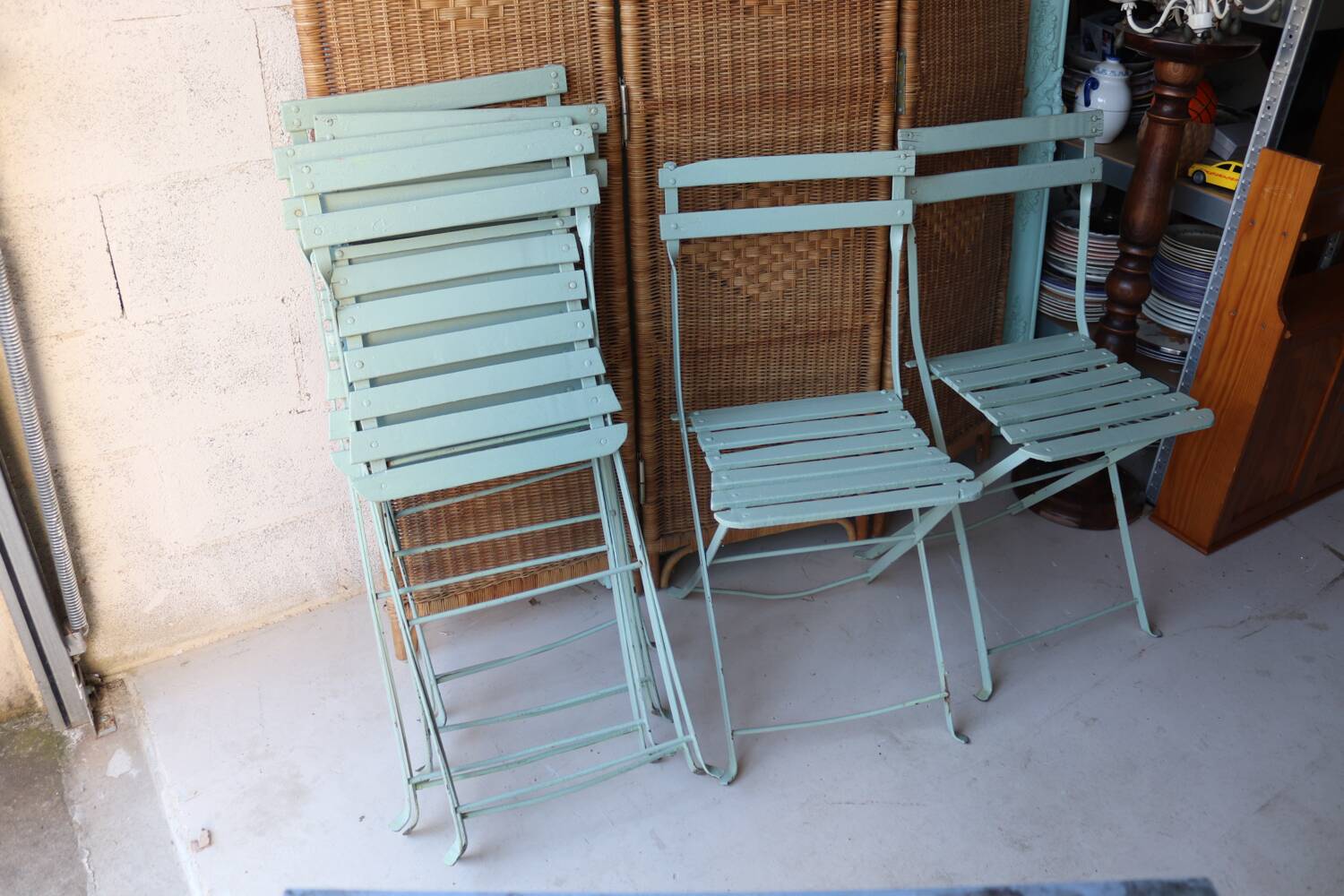 6 antique folding garden chairs made of painted wood and metal.