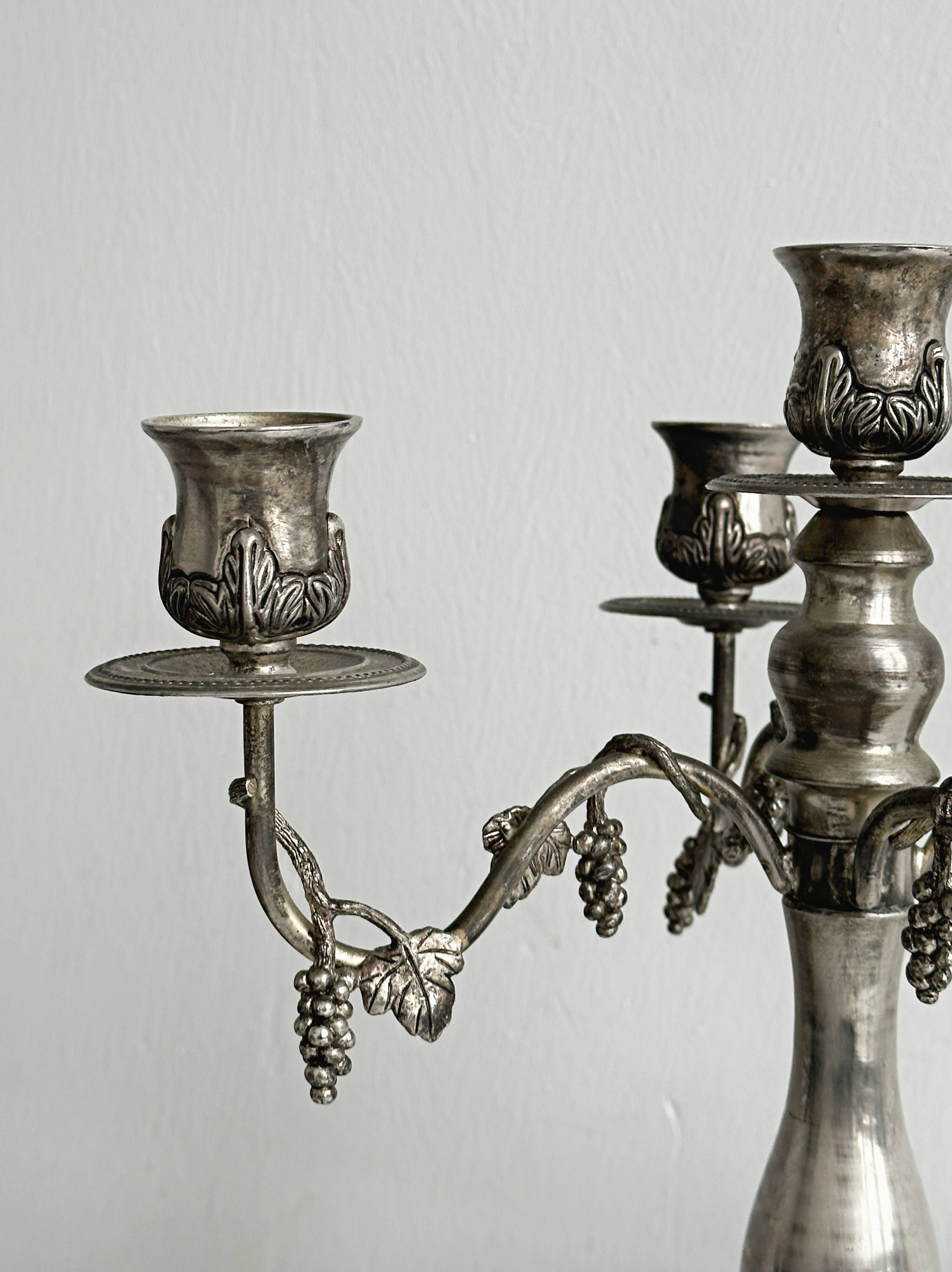 Chandelier, antique 5-branch metal candlestick.