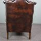 Chesterfield armchair with armrests