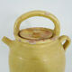 Old jug, chevrette, water pitcher in glazed yellow sandstone. Early twentieth century