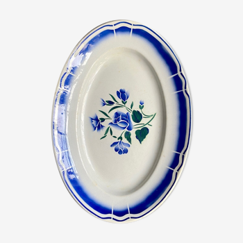 Oval flat in white and blue glazed earthenware