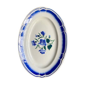 Oval flat in white and blue glazed earthenware