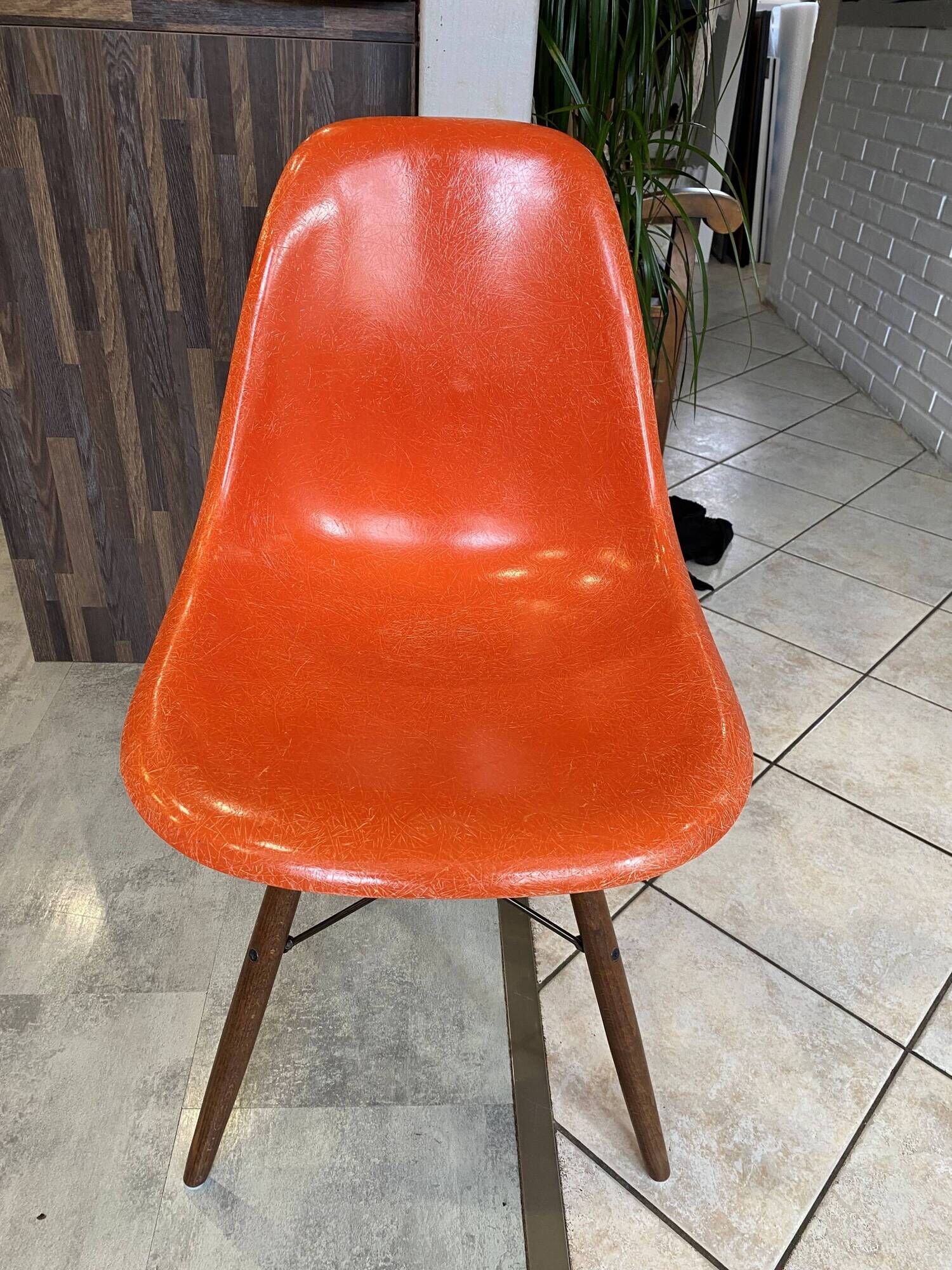 A vintage 70s Eames Herman Miller DSW Fiber Red Orange Dowel Walnut Chair
