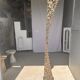 Indonesian construction element in carved wood with intertwined plant motifs mounted on a base (fri
