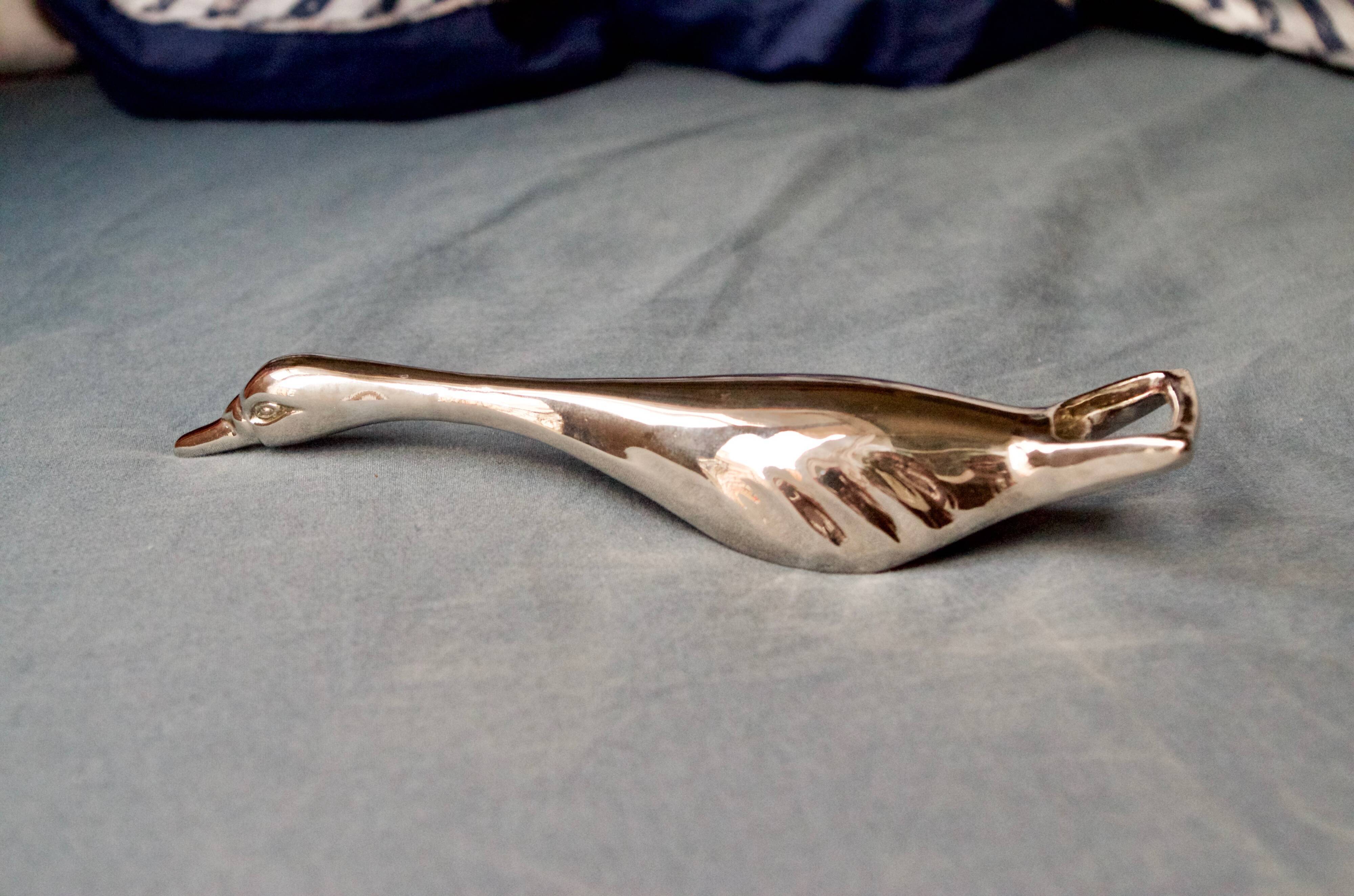 Vintage goose in flight bottle opener in silver metal
