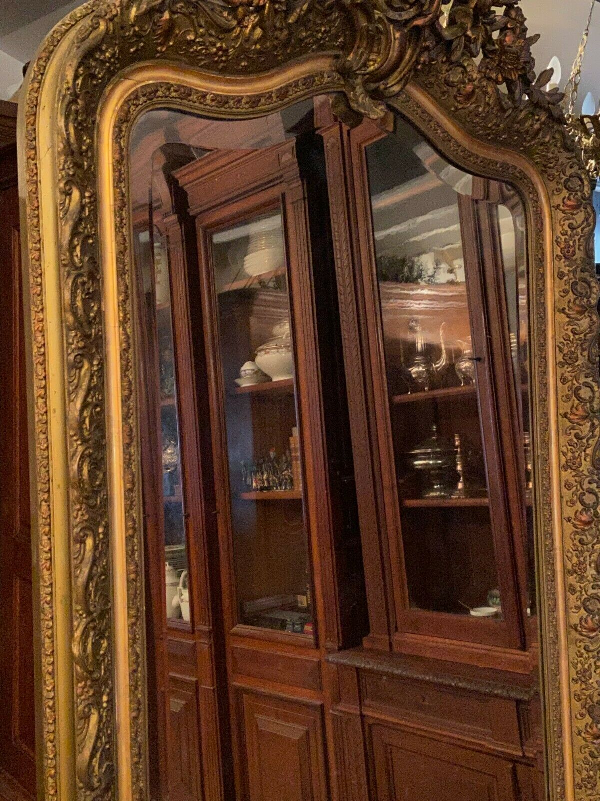 Golden mirror with bevelled ice pediment in Regency style