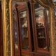 Golden mirror with bevelled ice pediment in Regency style
