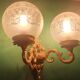 Pair of large double-light wall sconces in vintage brass and glass