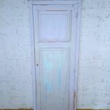 Rustic antique bonnetière in weathered blue-grey wood.