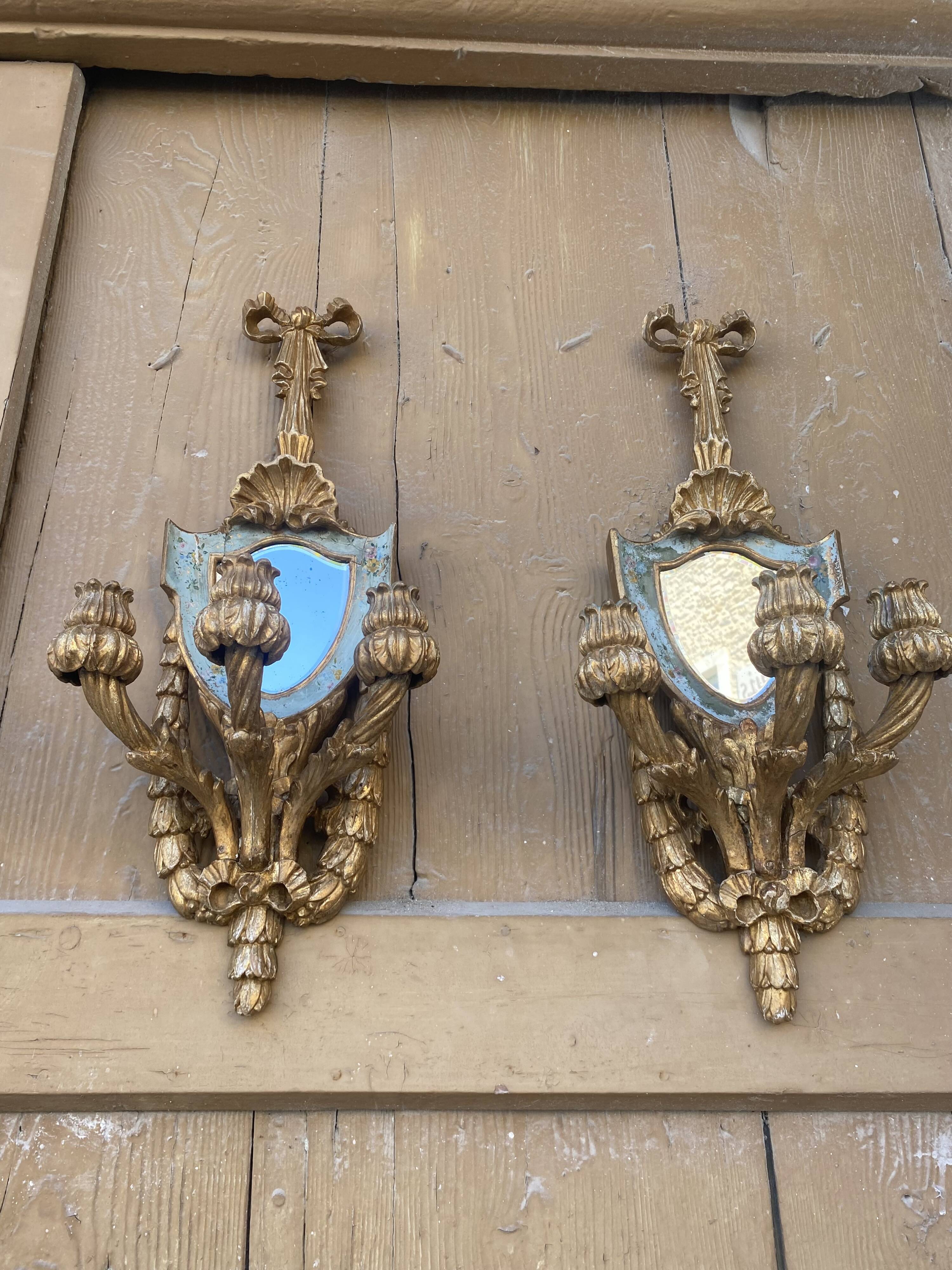 Pair of carved wood sconces