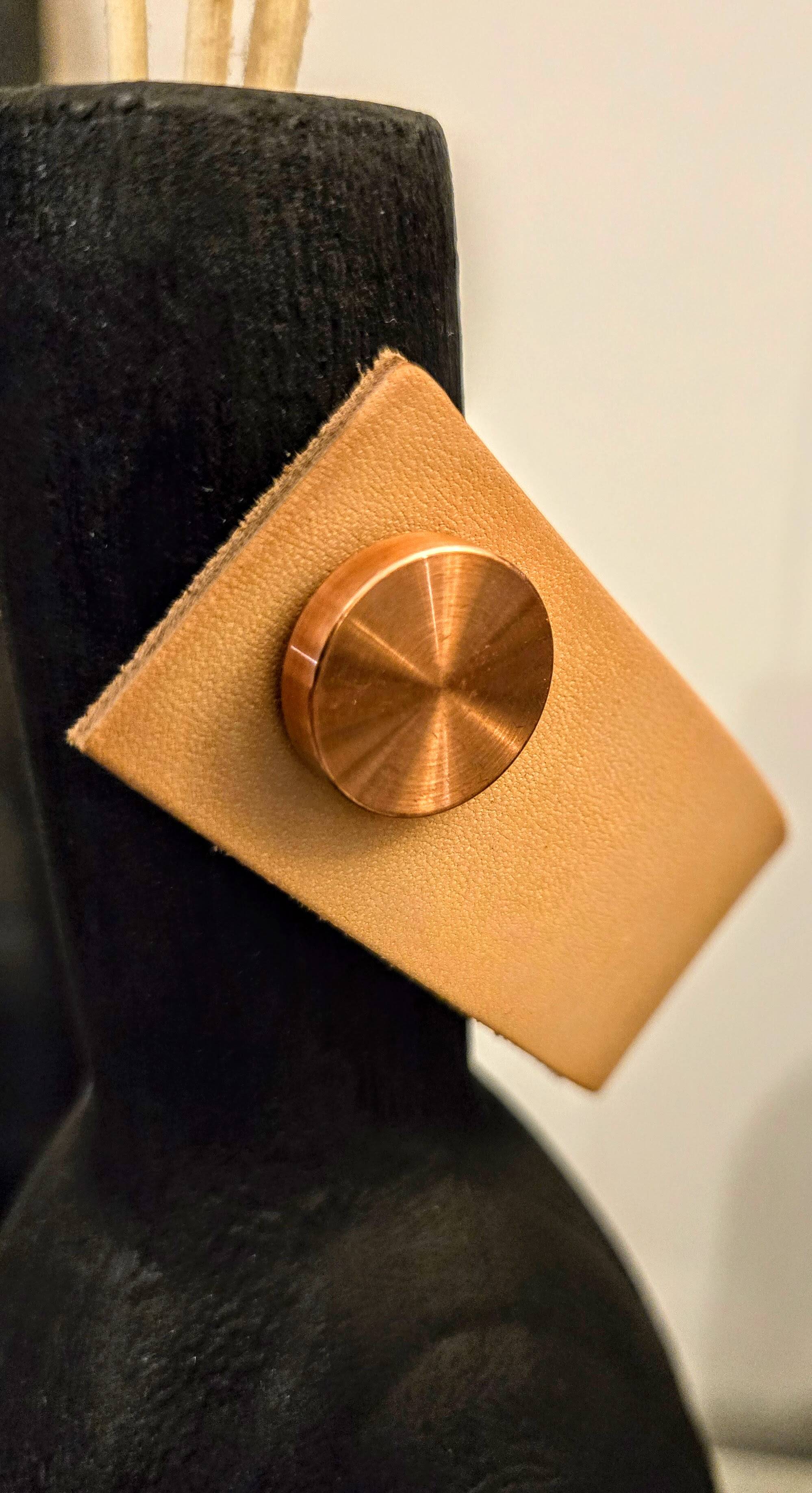 Burnt wood vase for dried flowers, leather and brass handle.