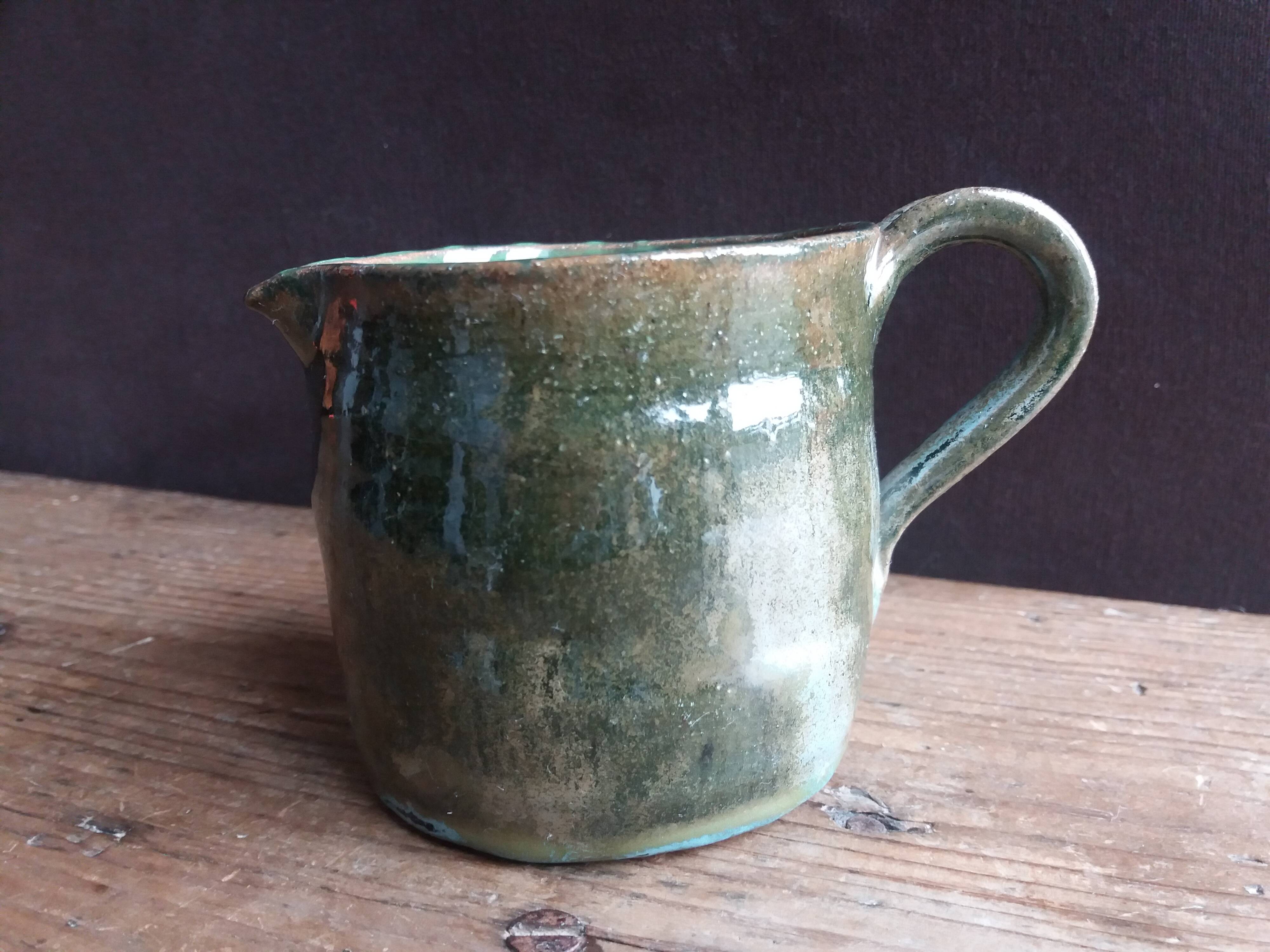 Handcrafted enameled terracotta pitcher signed
