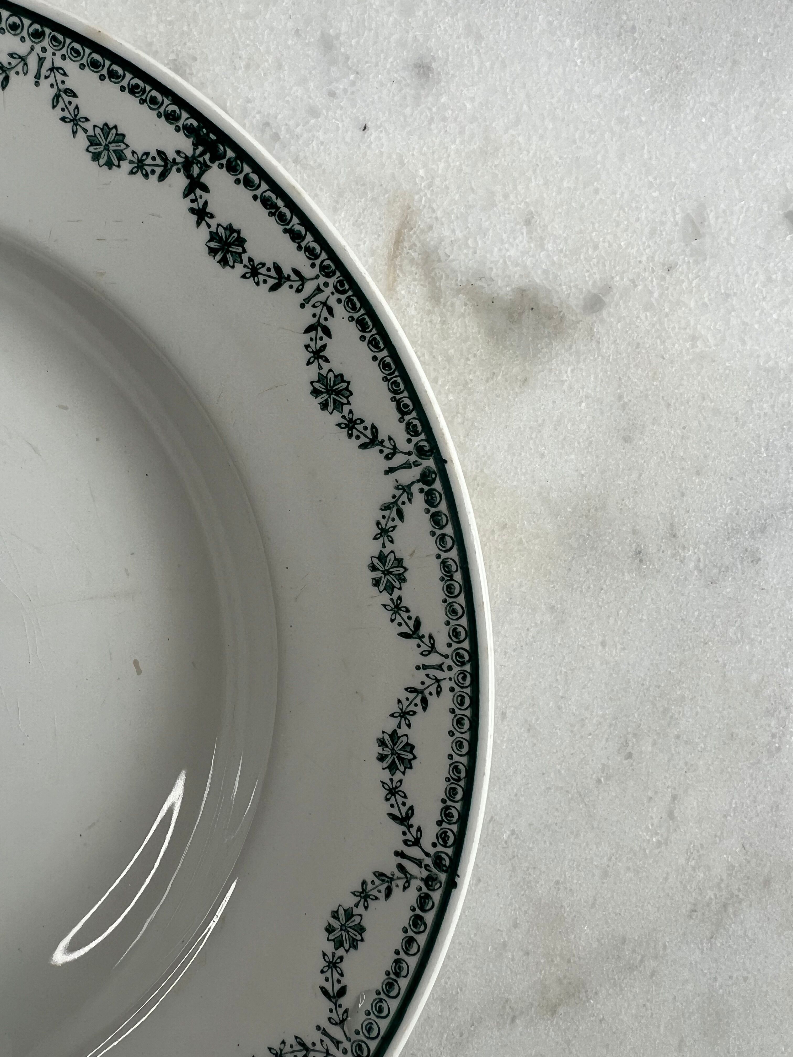 Set of two green frilled deep plates from Saint-Amand.