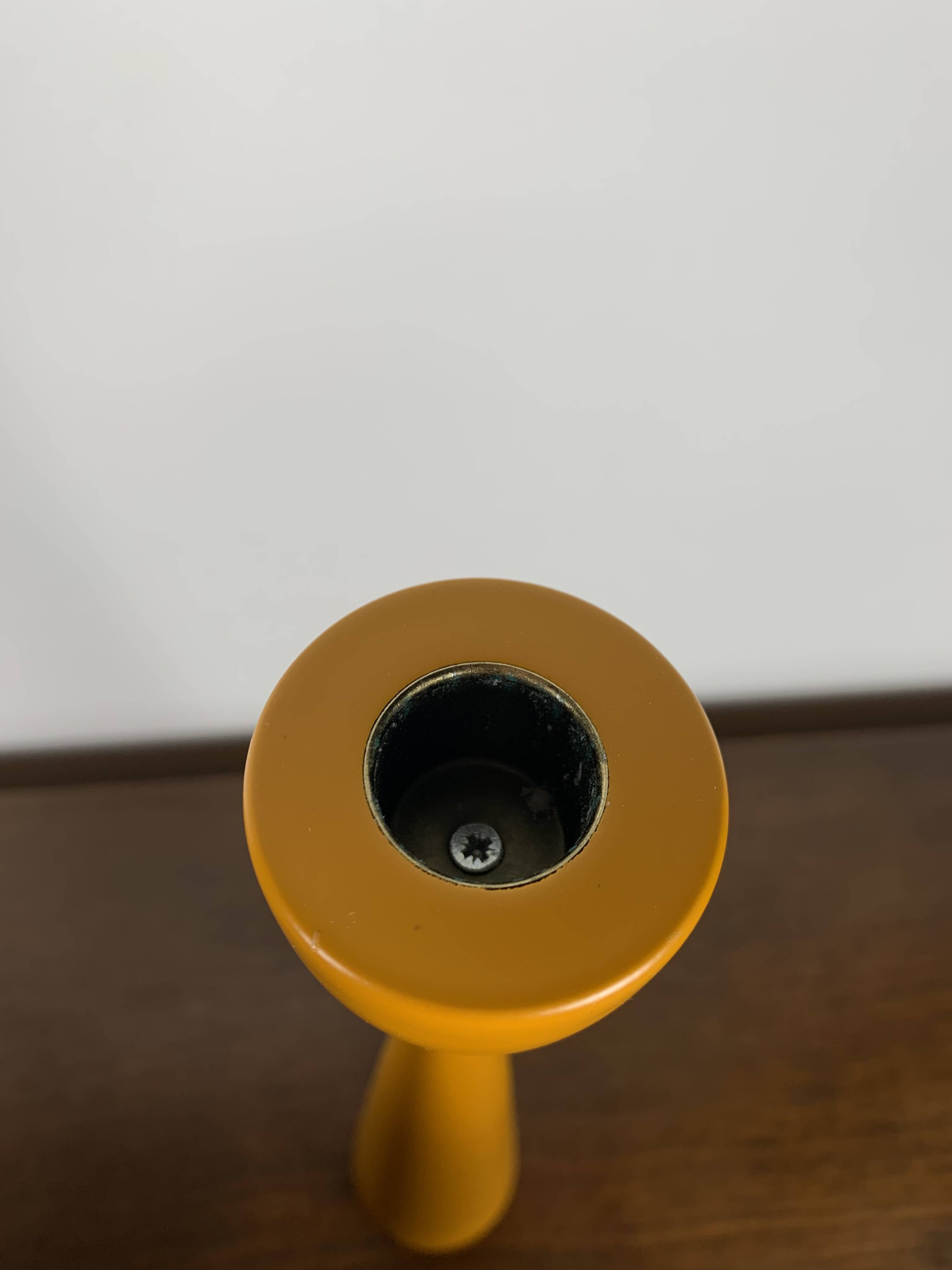Large candle holder in orange-yellow lacquered wood