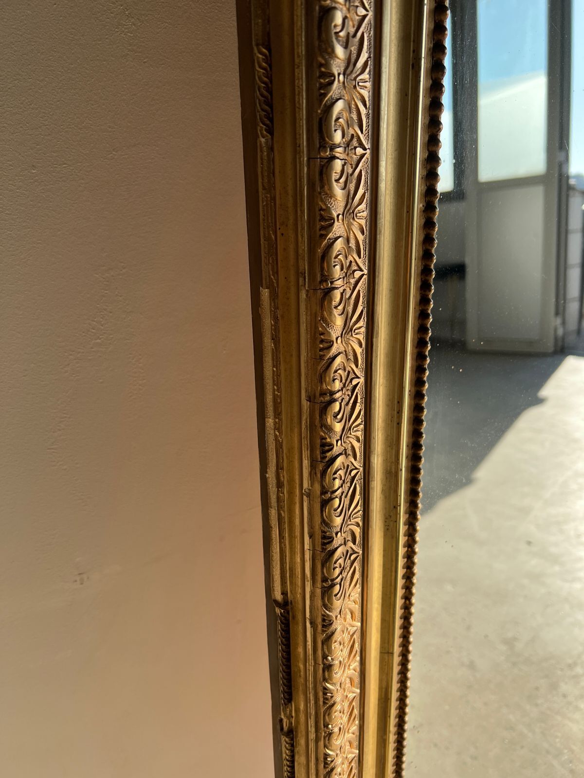 Gilded mirror with frieze h2m10 l:73cm