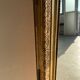 Gilded mirror with frieze h2m10 l:73cm