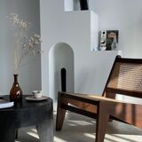 Reclined armchair in canned teak in natural wood