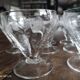 Lot de 11 coupes à champagne en verre ancien ciselé décor floral sur pied bas