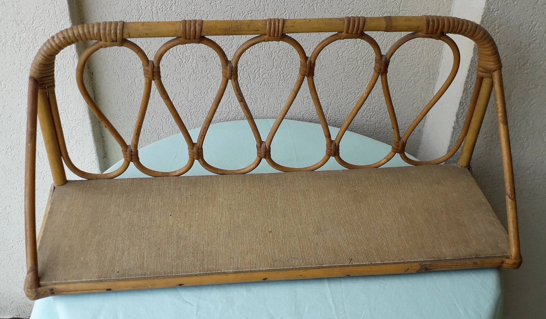 Wall shelf in rattan