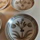Vintage hollow plates in sandstone series of four marked Longchamp